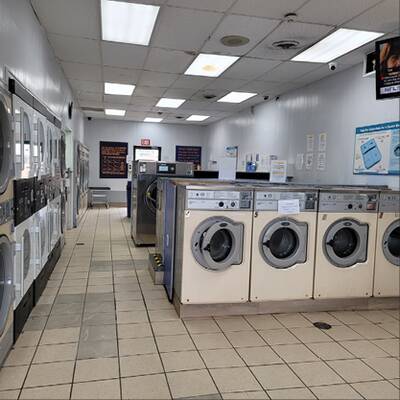 UNATTENDED COIN LAUNDROMAT AND DRY CLEANING PLANT WITH PROPERTY
